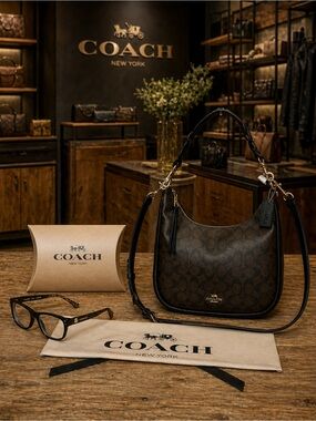 Coach. 4 Piece Set: Jules Hobo Bag with Free Eyeglasses, Dust Bag & Gift Box.